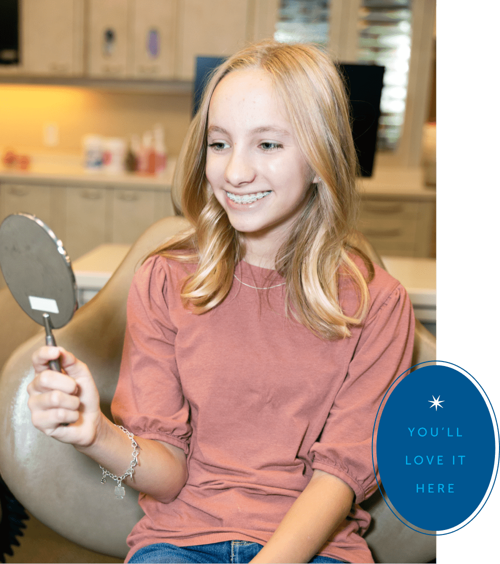 teen girl smiling at orthodontic appointment